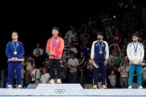 Men's 57kg free-style wrestling medal ceremony: Spencer Richard Lee, silver, Rei Higuchi, gold, Aman Sehrawat and Gulomjon Abdullaev, bronze